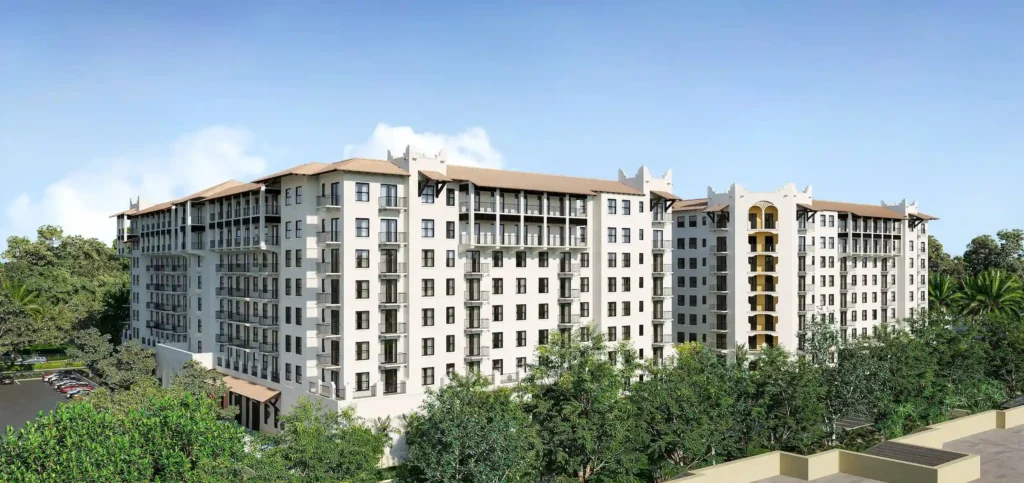 Architectural rendering of a modern multi-story residential building surrounded by lush greenery and trees under a clear blue sky.