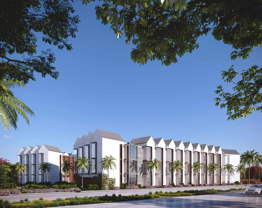 Modern townhouse complex with palm trees and blue sky.