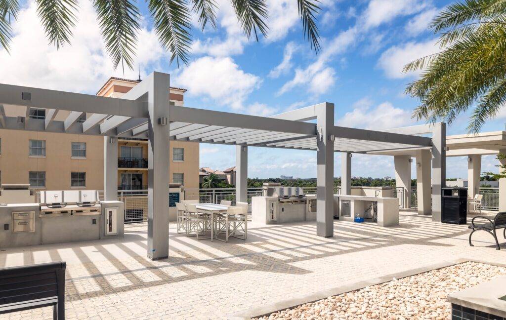 Modern rooftop terrace with dining setup and city views