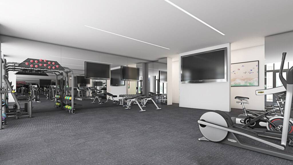 Modern gym with state-of-the-art equipment, featuring weights and cardio machines in a sleek, spacious setting.