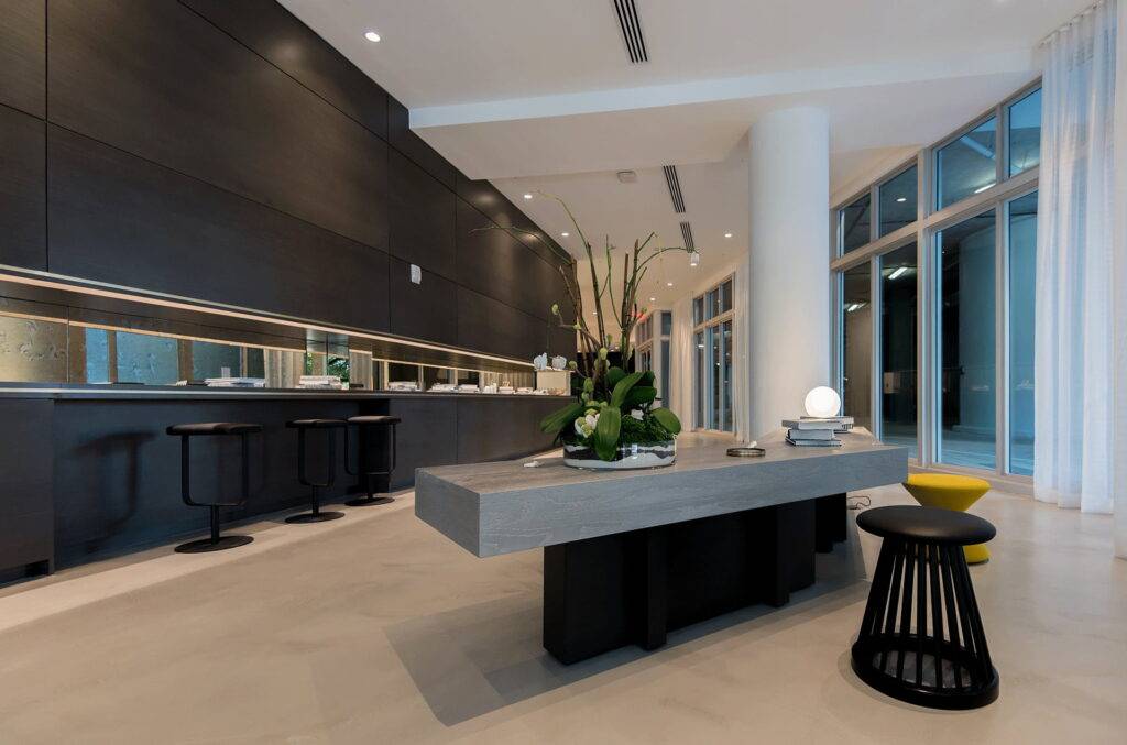 Modern interior with sleek design, long gray table, and contemporary decor