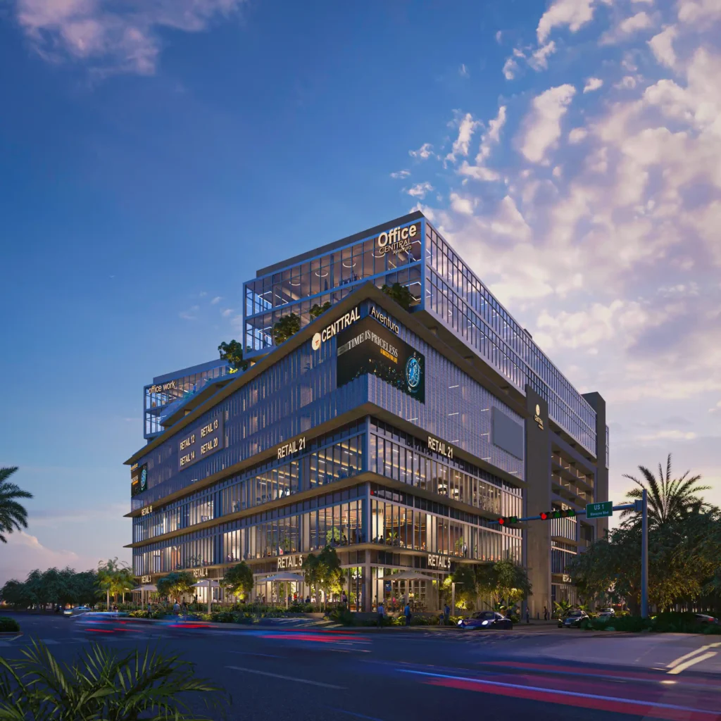 Modern multi-story office building against a vibrant sky, illuminated by warm evening light.