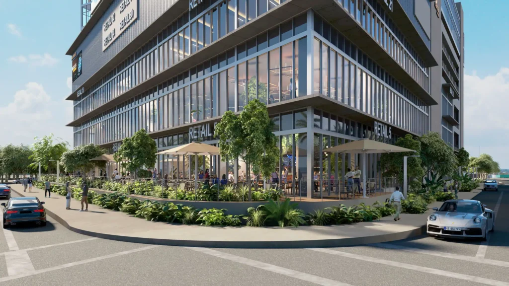 Modern urban building with sleek glass facade and outdoor patio dining.