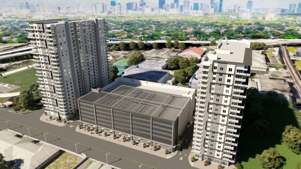 Aerial view of modern residential towers with city skyline in the background.