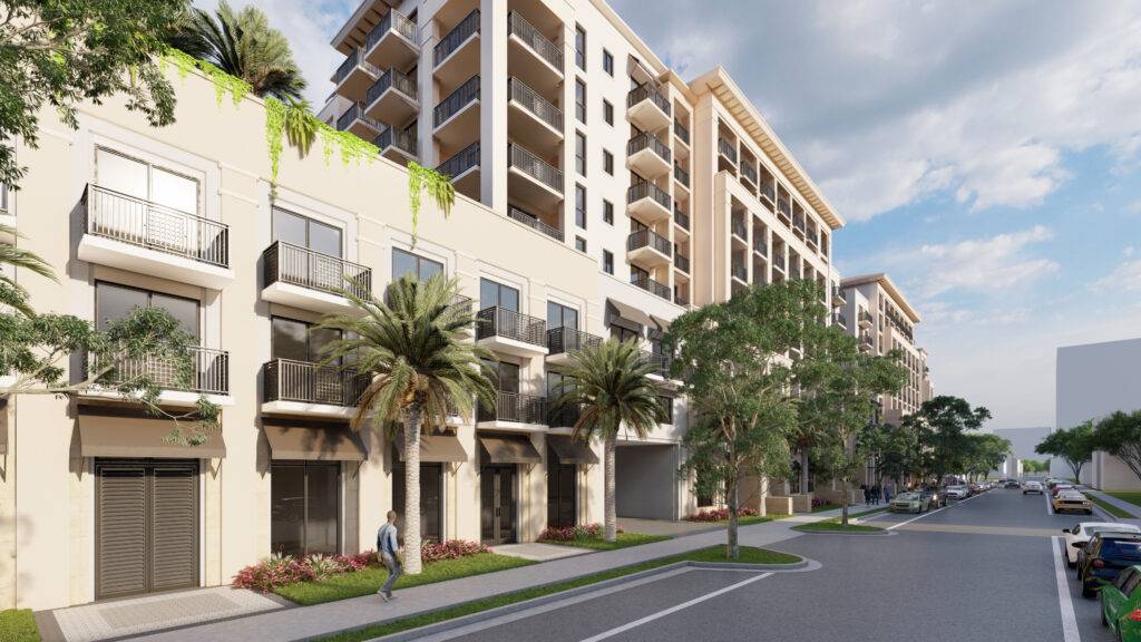 Modern apartment building with lush greenery and a person walking on a sunny street.
