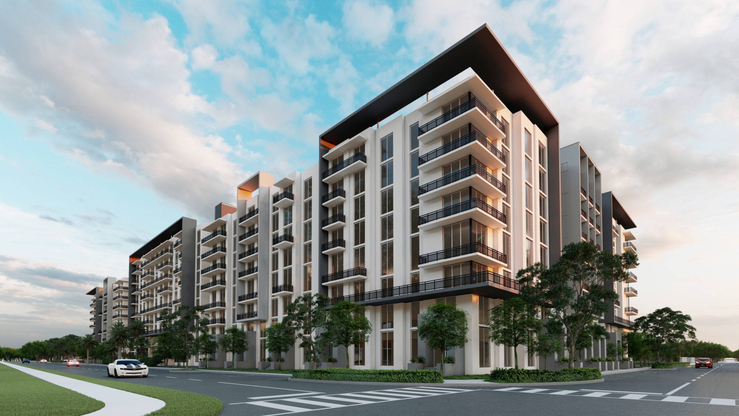 Modern apartment complex with sleek design against a vibrant blue sky backdrop.