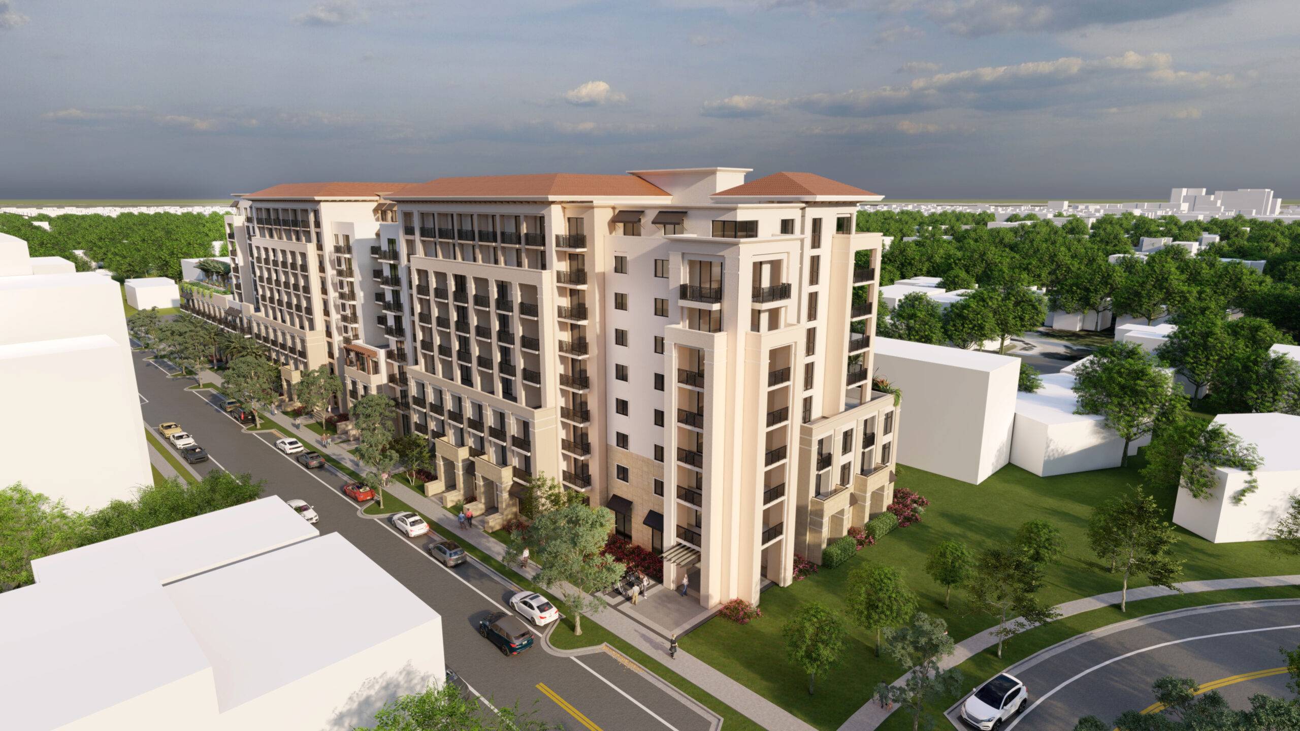Aerial view of a modern multi-story residential building with lush green surroundings and a bustling street.