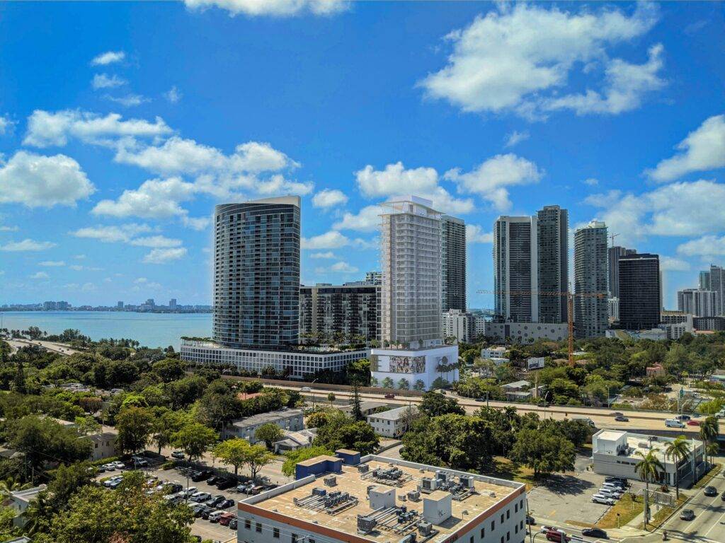 Miami skyline with tall buildings under a bright blue sky