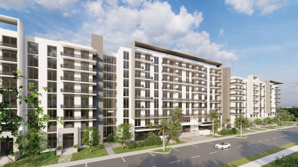 Modern apartment complex with lush greenery and a clear blue sky.