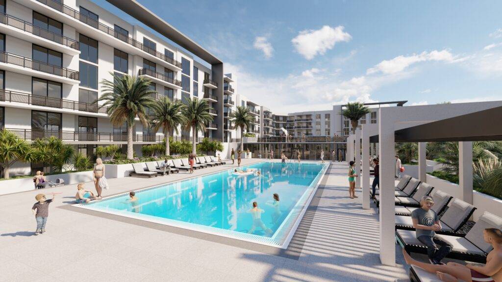 Luxurious modern apartments overlooking a scenic outdoor pool with palm trees.