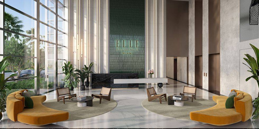 Modern lobby of Elle Residences Miami with sleek furniture and tall windows.