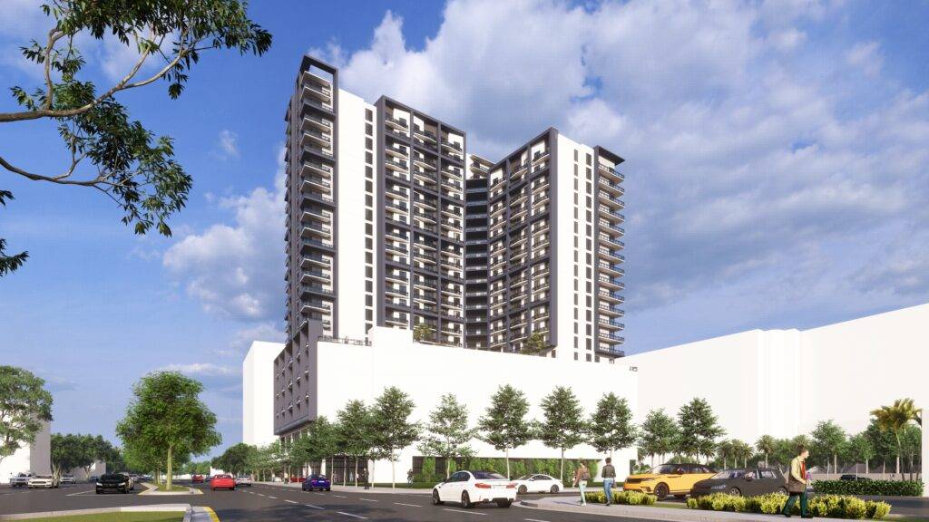 Modern high-rise apartment building with sleek design surrounded by trees and parked cars under a cloudy sky.