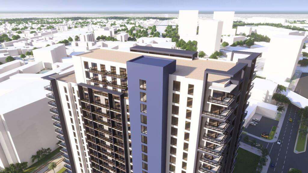 Aerial view of a modern high-rise building with a blue vertical accent, surrounded by urban landscape.