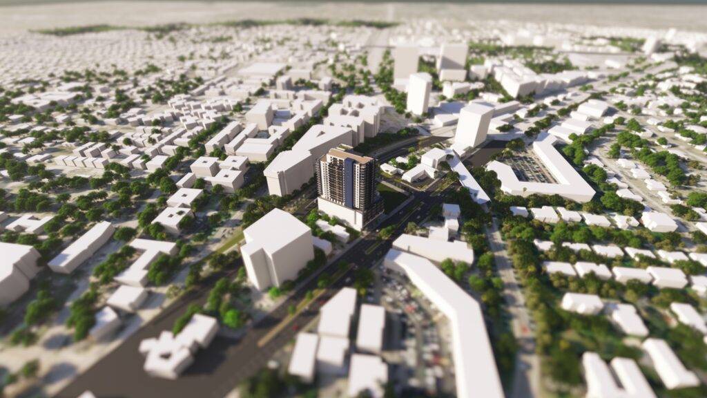 Aerial view of a modern urban landscape with tall buildings and green spaces.