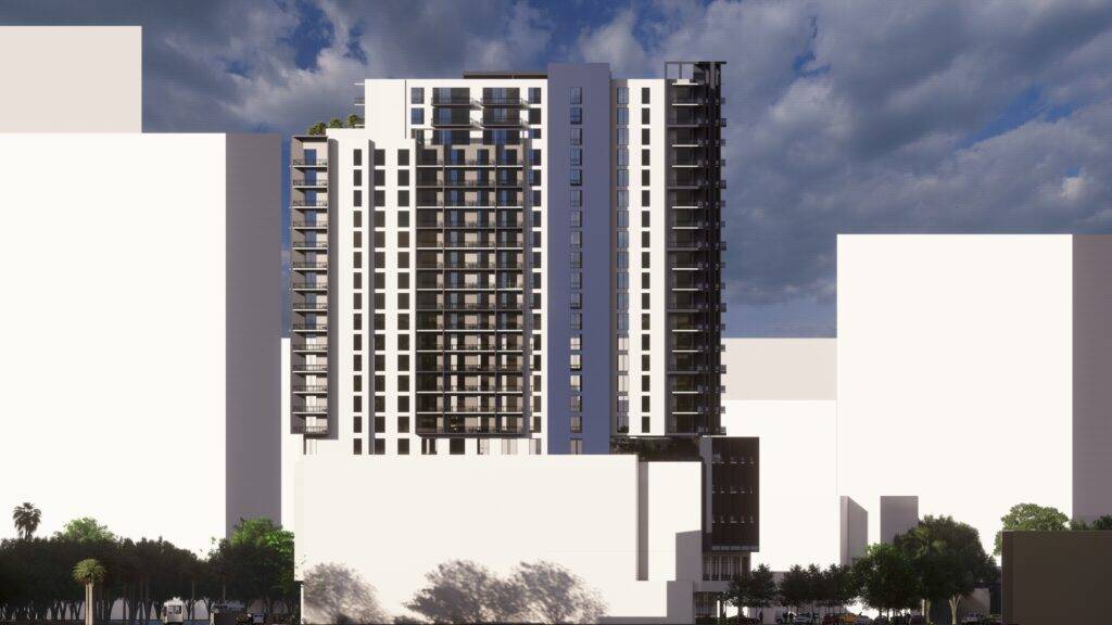 Urban landscape with modern high-rise buildings under a partly cloudy sky.