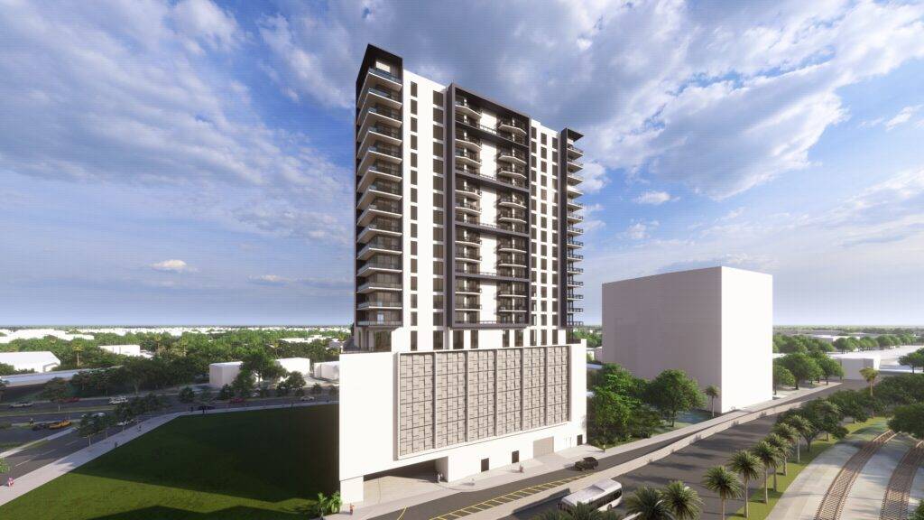 Modern high-rise building with a sleek design against a blue sky backdrop.
