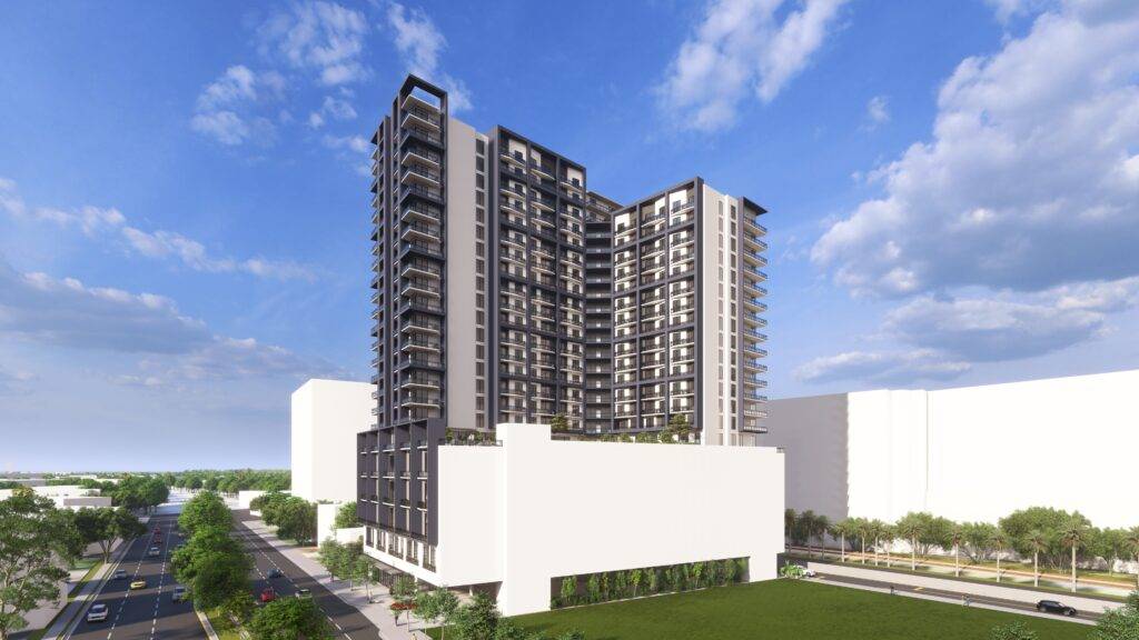 Modern high-rise building set against a bright blue sky with scattered clouds.