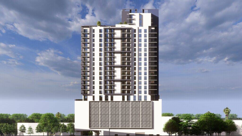 Modern high-rise building with a sleek design against a cloudy sky.