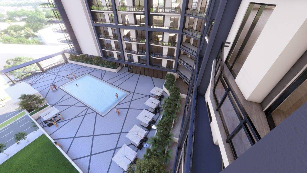 Luxurious rooftop pool with modern lounge chairs and urban skyline view.