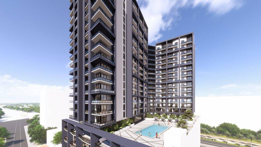 Modern high-rise residential building with a pool, set against a blue sky.