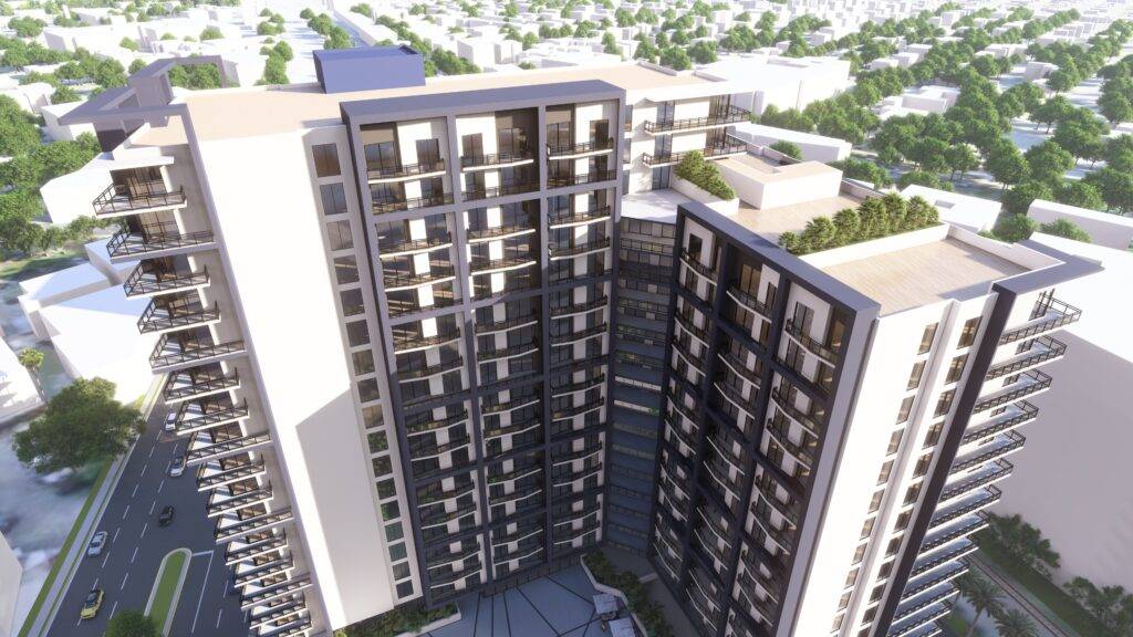 Aerial view of modern high-rise buildings with lush greenery on balconies.
