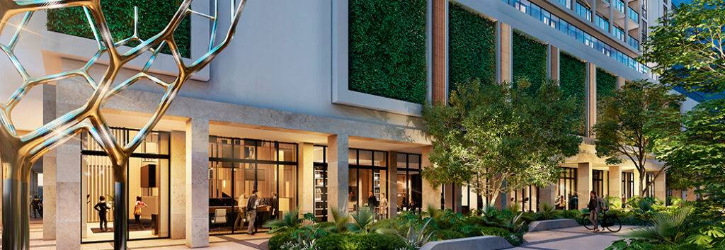 Modern hotel exterior with lush greenery and contemporary design elements.
