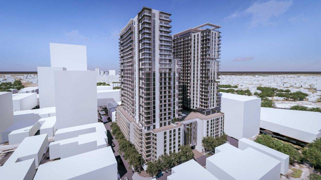 Modern high-rise building with sleek architecture surrounded by urban landscape.