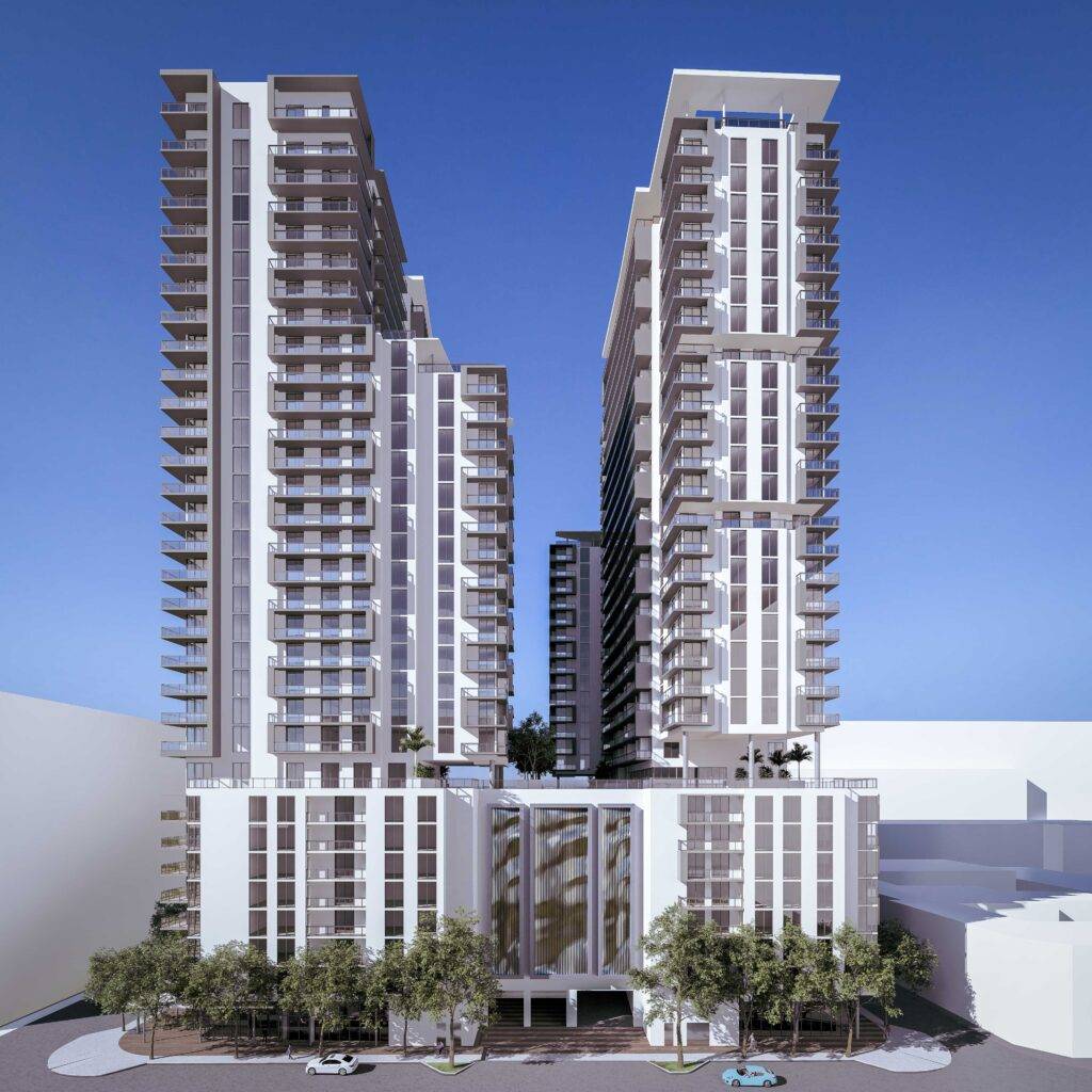 Modern high-rise buildings against a clear blue sky, highlighting urban design and architecture.