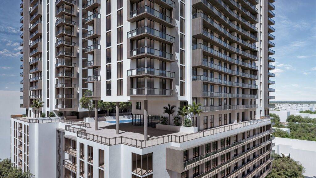 Modern high-rise building with spacious balconies and an elegant rooftop pool.