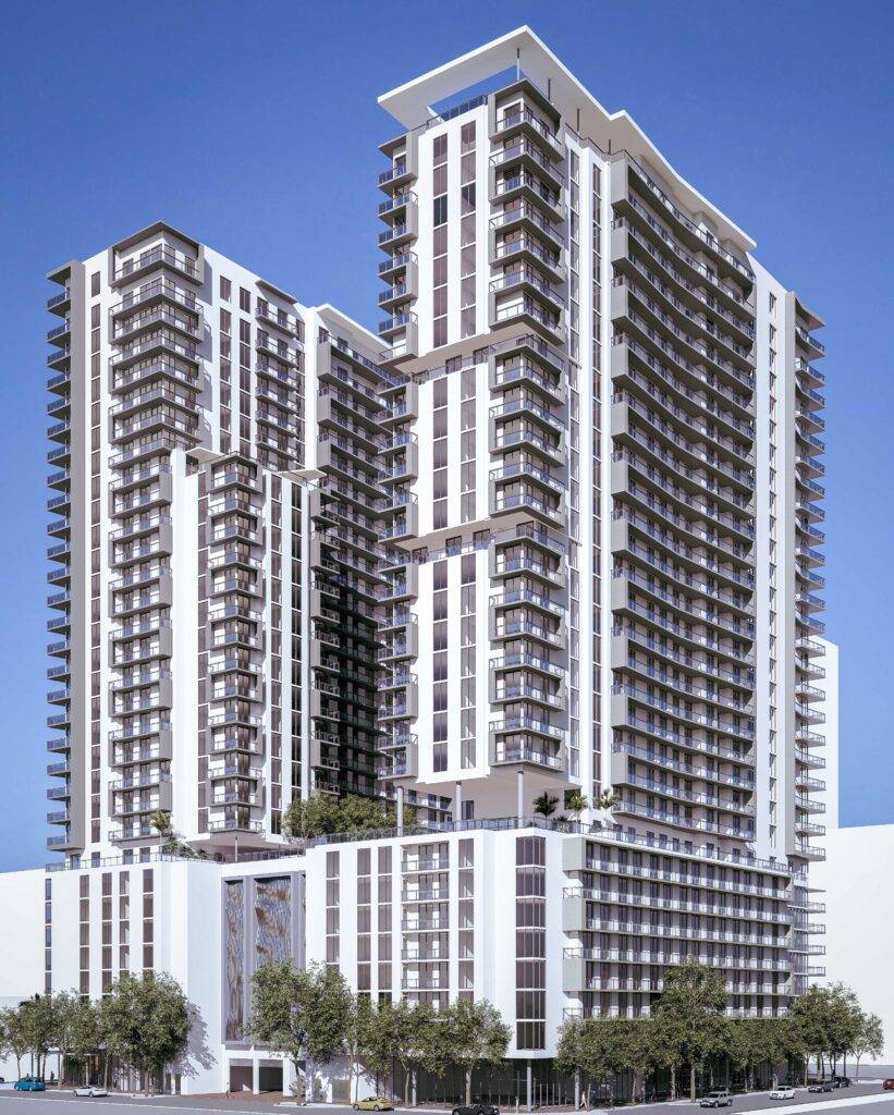 Modern high-rise building with sleek architecture against blue sky.