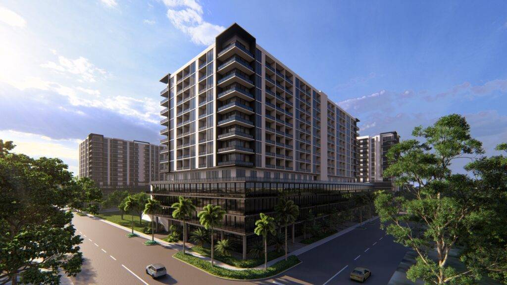 Modern apartment buildings with lush greenery and a bright blue sky