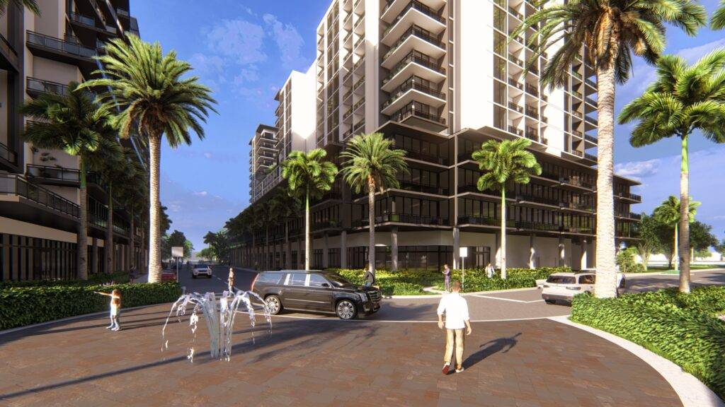 Urban street scene with fountains, palm trees, and a modern high-rise building under a sunny sky.