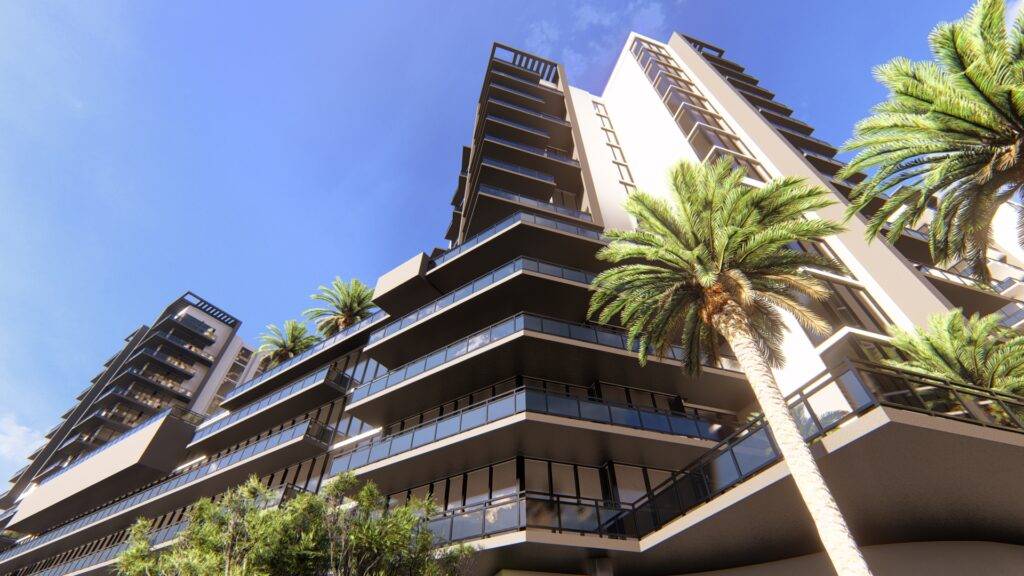 Modern architecture of a high-rise building with palm trees under a clear blue sky.