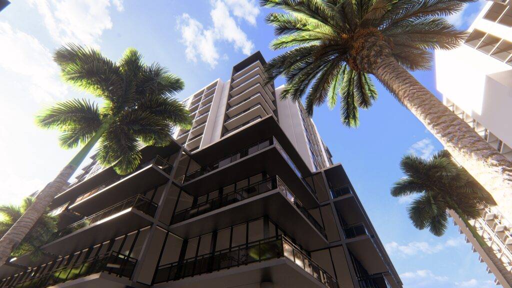A modern apartment building with tall palm trees under a bright blue sky.