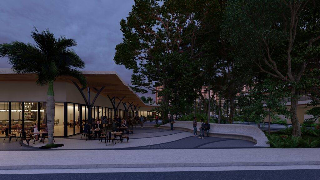 Evening view of a modern outdoor café surrounded by trees with people dining under a softly lit sky.