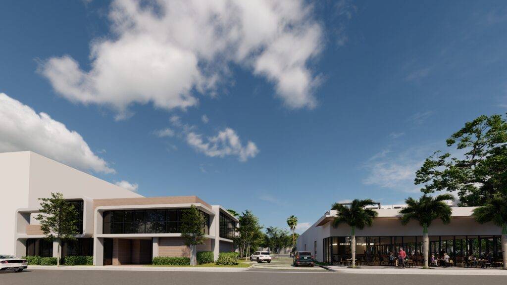 Modern architectural complex under a clear blue sky with lush greenery.