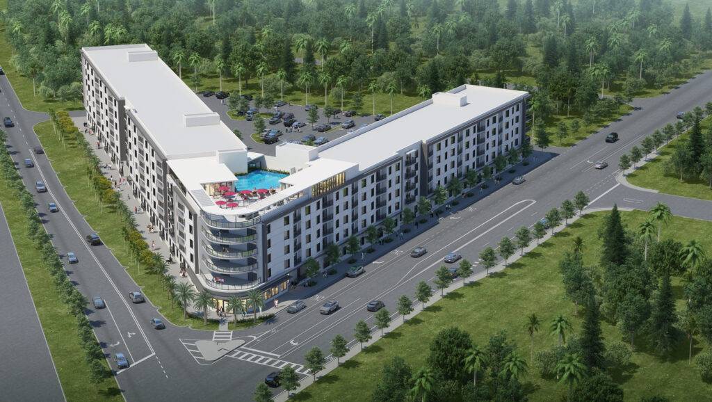 Aerial view of a modern apartment complex with a central pool, surrounded by lush greenery and roads.