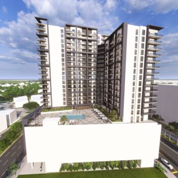Modern high-rise apartment building with rooftop pool and city views under a clear blue sky.