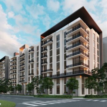 Modern apartment complex with sleek design against a vibrant blue sky backdrop.