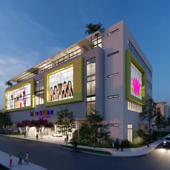 Modern building with large illuminated billboards at dusk