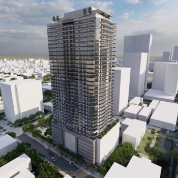 Modern high-rise building in an urban skyline with greenery on rooftops.