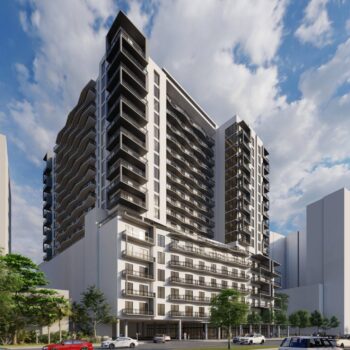 Modern high-rise building against a dynamic cloudy sky, surrounded by urban architecture.