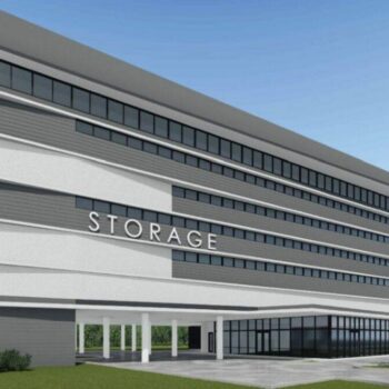 Modern multi-story storage facility with sleek architecture and ample parking space.