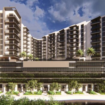 Modern architectural building with palm trees and dramatic sky in background